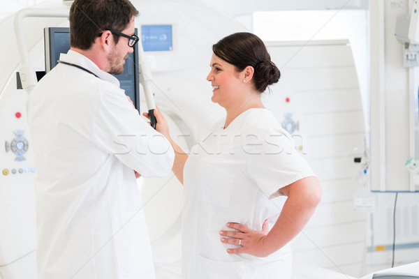 Doctor and nurse discussing image of MRI scan Stock photo © Kzenon