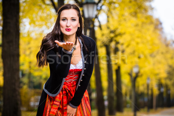 Girl in Dirndl blows a kiss Stock photo © Kzenon