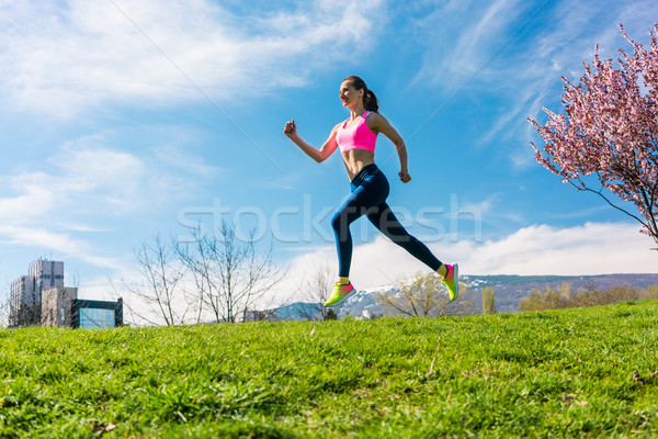 Woman sport running on hill for fitness Stock photo © Kzenon