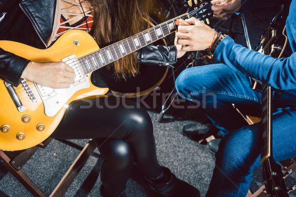Guitar music teacher helping his student Stock photo © Kzenon
