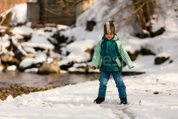 Boy with snow on river in Winter Stock photo © Kzenon