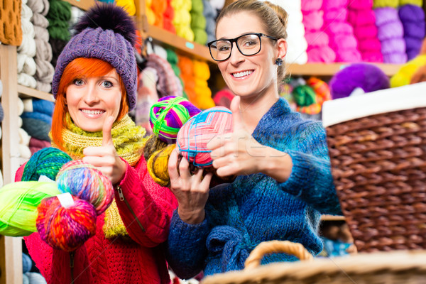 Young women in knitting fashion shop Stock photo © Kzenon