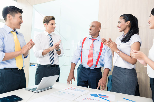 Indian CEO reporting success in business meeting Stock photo © Kzenon