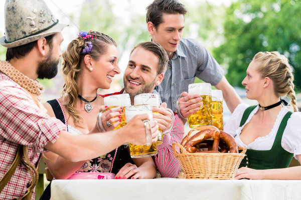 Friends in Bavarian beer garden drinking in summer Stock photo © Kzenon