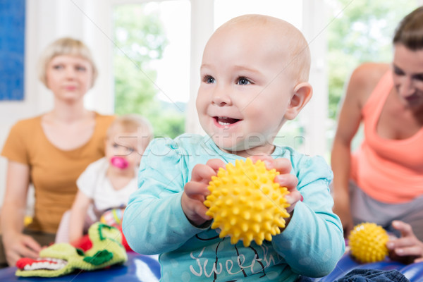 Babies with pacifier in toddler group playing with toys Stock photo © Kzenon