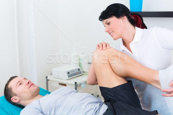 Physiotherapist medicate patient in practice  Stock photo © Kzenon