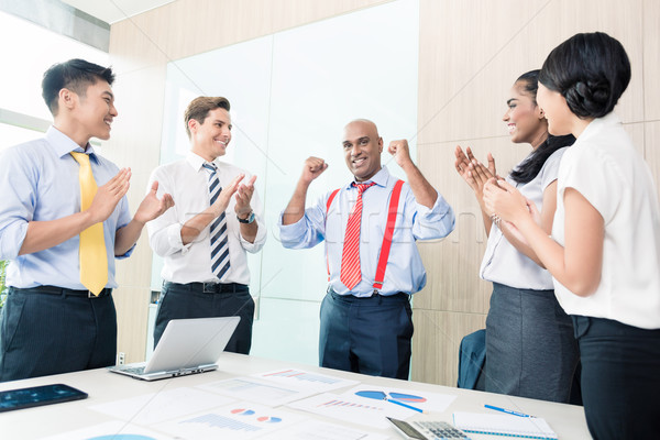 Indian CEO reporting success in business meeting Stock photo © Kzenon