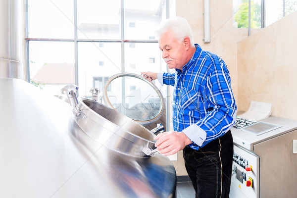 Brewer in brewhouse of beer brewery Stock photo © Kzenon