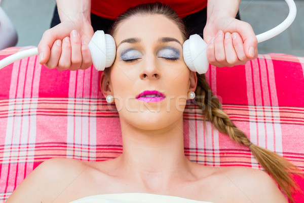 Woman having face massage in wellness spa Stock photo © Kzenon