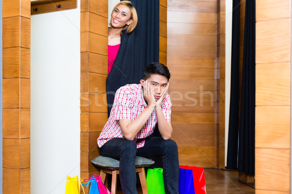 Man waiting for woman in front of dressing room  Stock photo © Kzenon