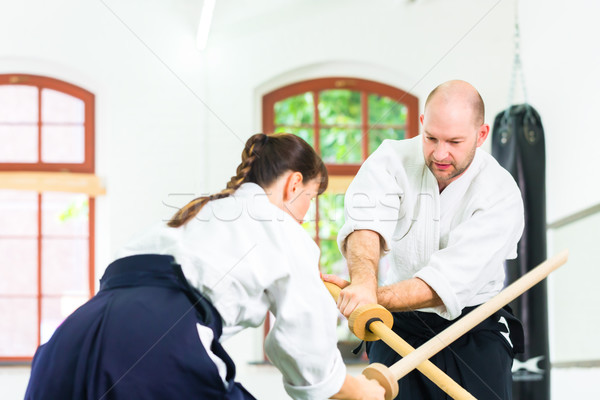 Man vrouw aikido zwaard strijd vechten Stockfoto © Kzenon