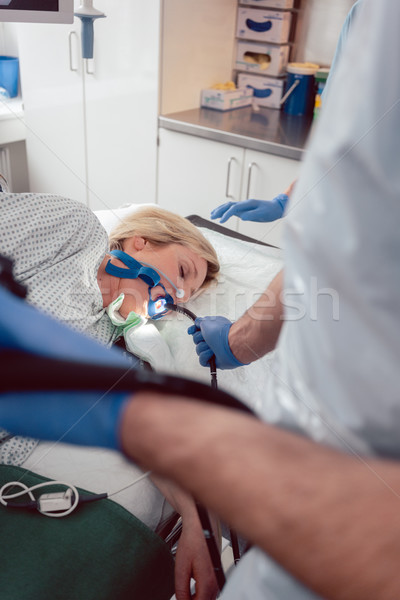 Doctor holding endoscope during gastroscopy in hand Stock photo © Kzenon