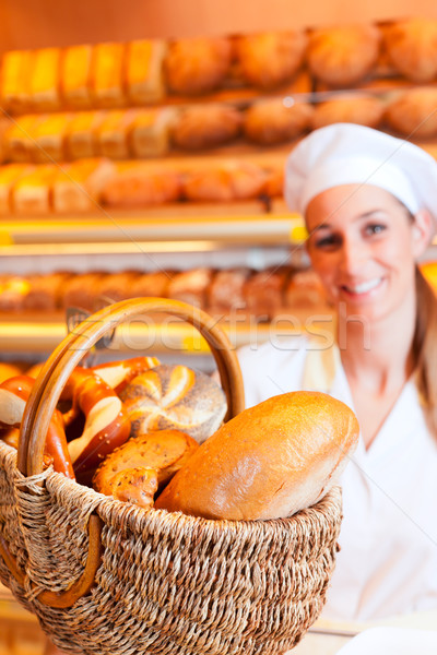 Female baker in her bakery Stock photo © Kzenon