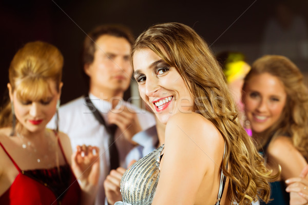 Stock photo: party people dancing in disco club
