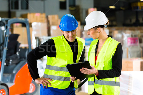 Stock photo: Forklift driver and supervisor at warehouse