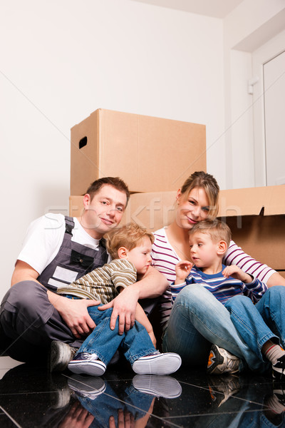 Family moving in their new home  Stock photo © Kzenon