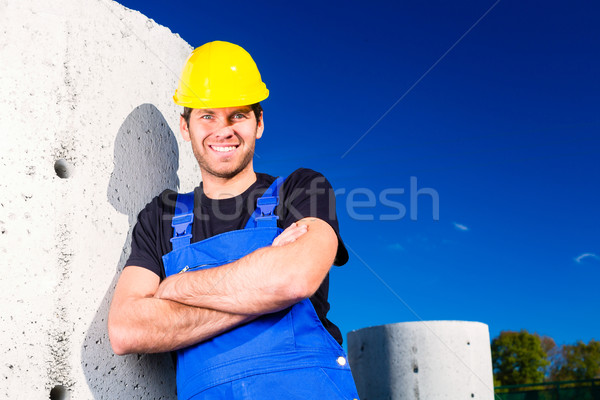 Builder of construction site with canalization project Stock photo © Kzenon