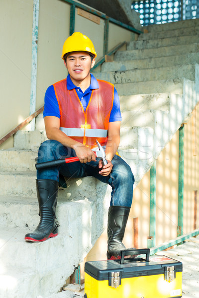 Asia indonesio trabajador de la construcción edificio casco Foto stock © Kzenon