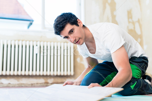 Floorer working in home in improvement project Stock photo © Kzenon