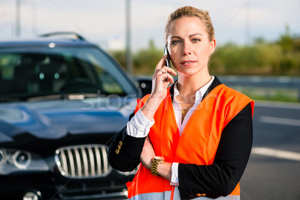 Woman with car breakdown calling towing company Stock photo © Kzenon