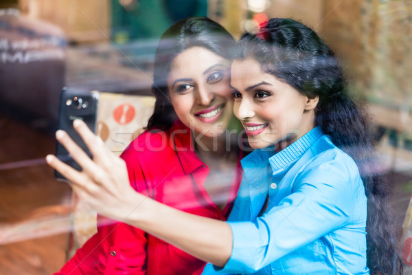 Stock photo: Customers in Indian cafe taking selfie