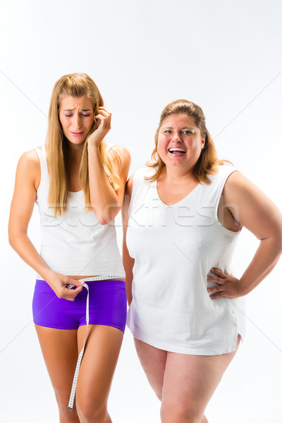 Thin and fat woman measuring waist with tape Stock photo © Kzenon
