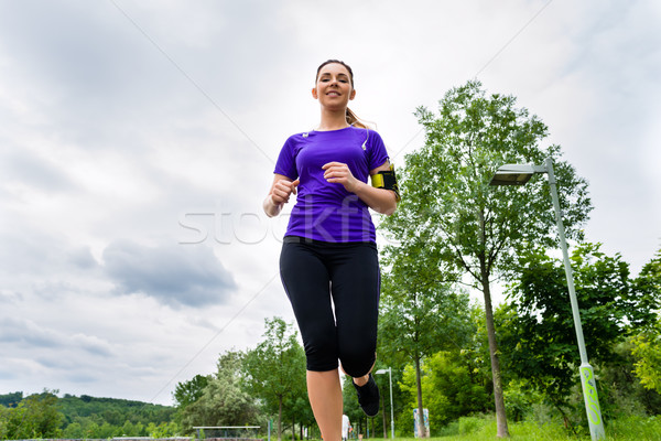 Sports outdoor - young woman running in park Stock photo © Kzenon