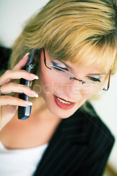 Stock photo: Female manager with cellphone