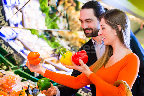 Couple selecting vegetables in hypermarket Stock photo © Kzenon