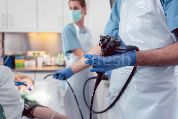 Team of doctors performing endoscopy in hospital Stock photo © Kzenon