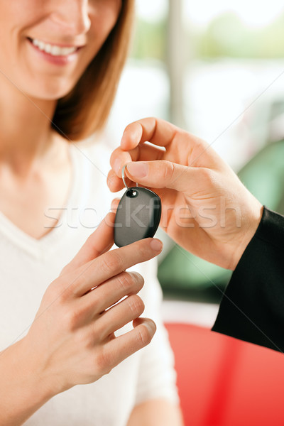 Woman buying car - key being given Stock photo © Kzenon