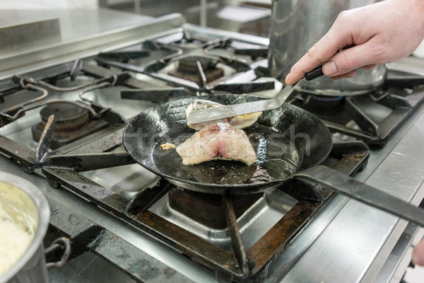 Szakács szakács étterem ponty hal serpenyő Stock fotó © Kzenon