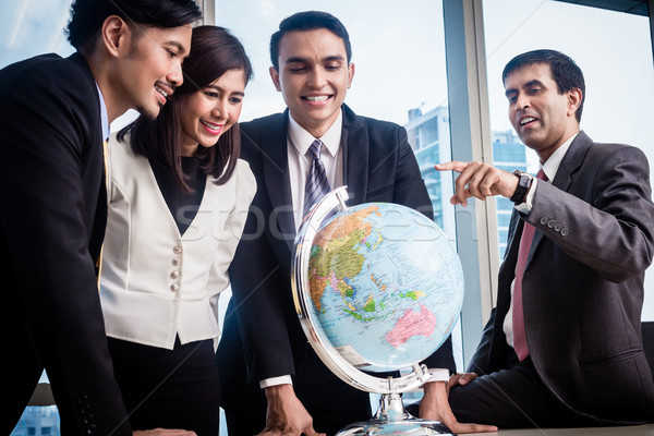 Businesspeople talk about global strategy Stock photo © Kzenon