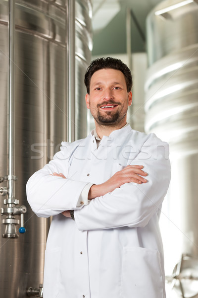 Beer brewer in his brewery Stock photo © Kzenon