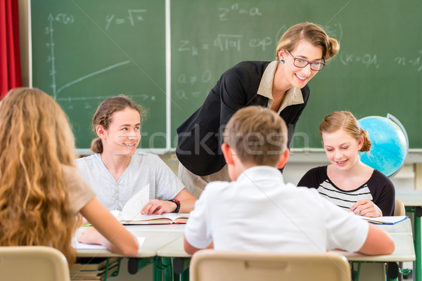 Teacher teaching students  geography lessons in school Stock photo © Kzenon