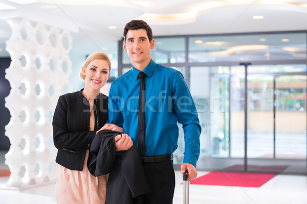 Man and woman arriving at hotel lobby with suitcase  Stock photo © Kzenon