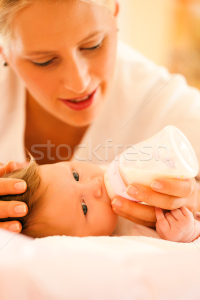 Mother is feeding the baby Stock photo © Kzenon