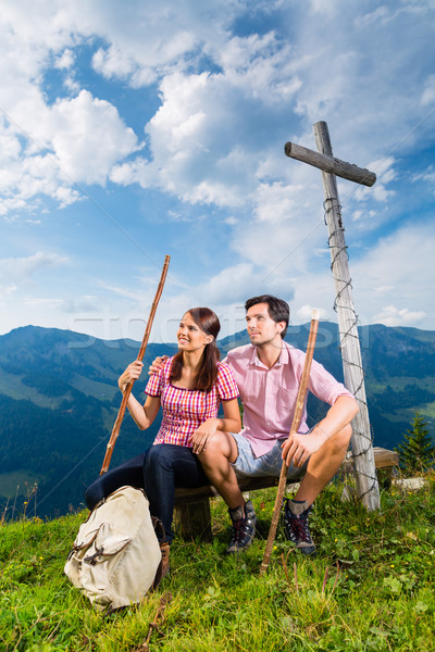 Alps - Hiking Couple takes break in mountains Stock photo © Kzenon