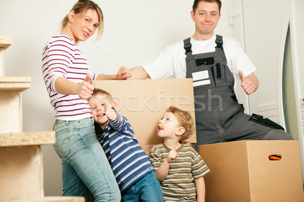 Family moving in their new home Stock photo © Kzenon