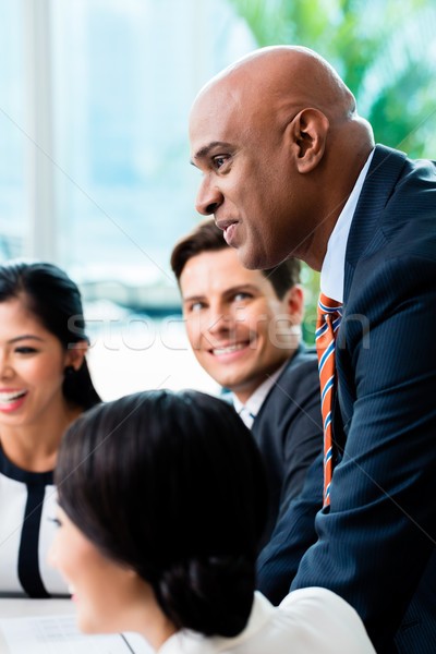 Indian Business man leading team meeting Stock photo © Kzenon