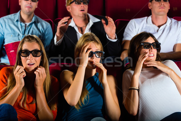 Group of people watching 3d movie at movie theater Stock photo © Kzenon