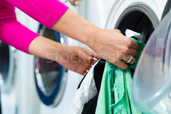 Female student in a laundry Stock photo © Kzenon