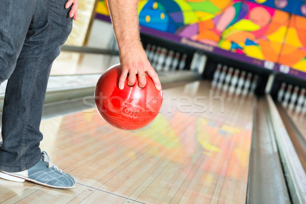Young man bowling having fun Stock photo © Kzenon