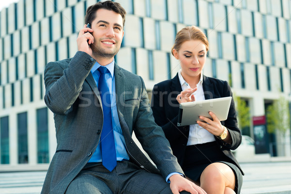 Stock photo: Businesspeople working outdoor with tablet computer