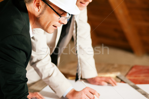 Architect and construction engineer discussing plan Stock photo © Kzenon