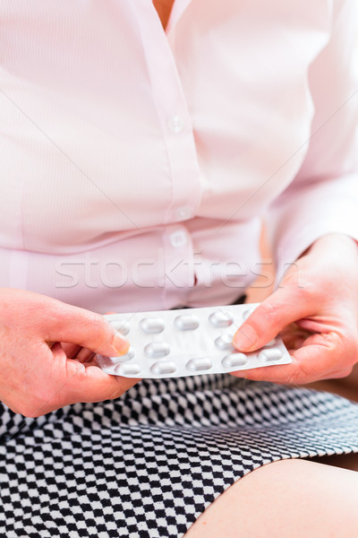 Senior medicate with pills at home Stock photo © Kzenon
