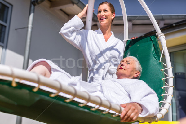 Women realxing on lounger in wellness spa Stock photo © Kzenon