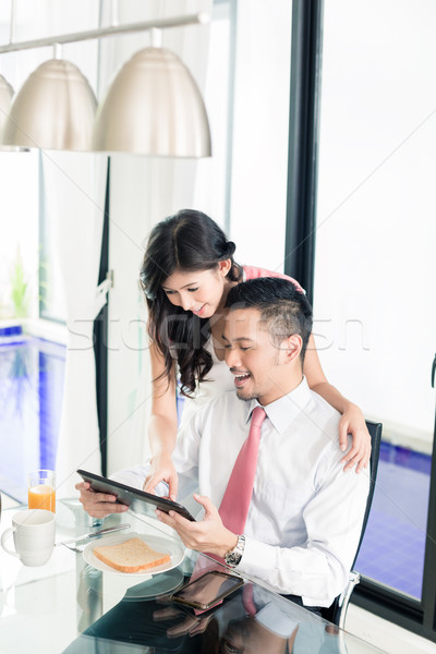 Couple having breakfast before man goes to office Stock photo © Kzenon
