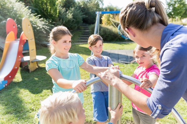 Stock photo: Family having fun at adventure playground in park