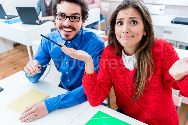 Students in College - woman having no clue Stock photo © Kzenon